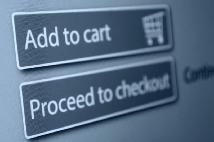 Traditional shopping cart buttons being replaced by AI-driven autonomous checkout — the shift from manual purchasing to agentic commerce