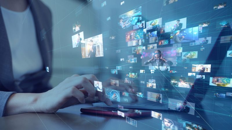 Content creation workflow with digital tools and planning materials on a desk