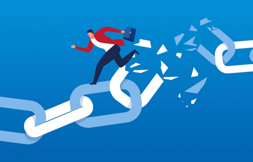 Businessman running across a chain that breaks apart ahead of him, illustrating the risk of broken internal links