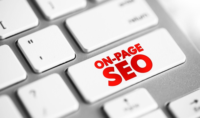 Close-up of a keyboard with a red ON-PAGE SEO key, representing on-page optimisation for Shopify product and collection pages