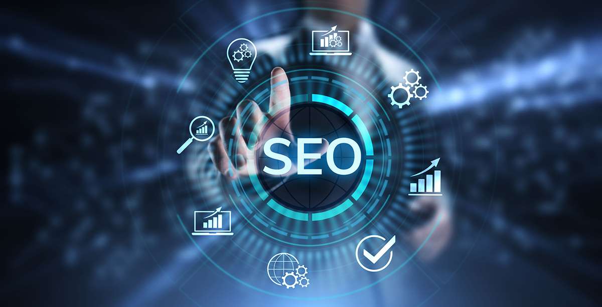 Writer planning an SEO and AI-optimised blog post with search analytics on screen